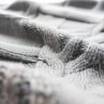 Close up braided cable knit pattern texture detail